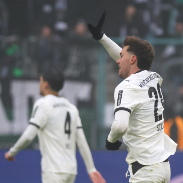 Joe Scally waving after scoring for Borussia Moenchengladbach.