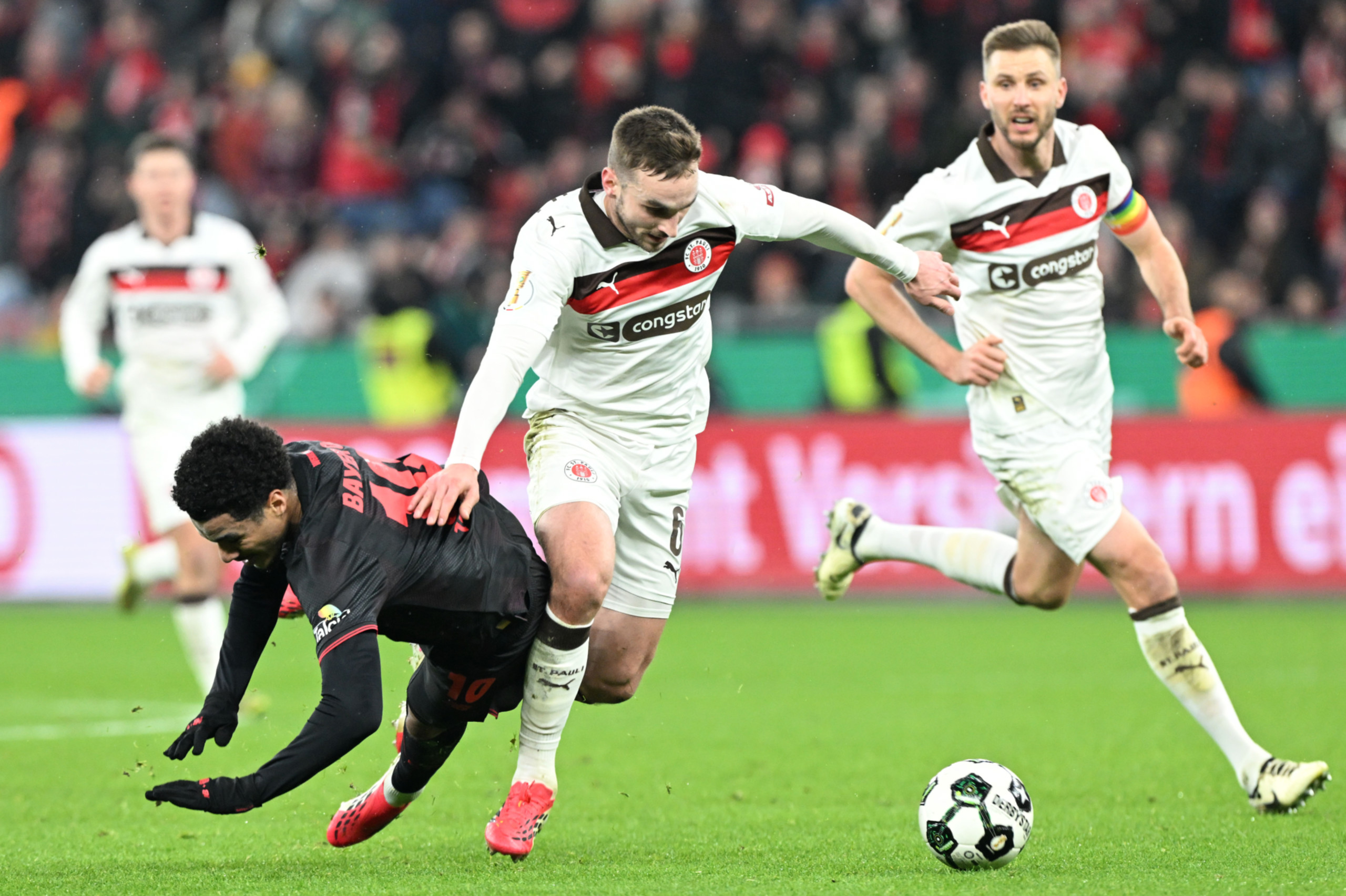 St Pauli player James Sands on the ball.